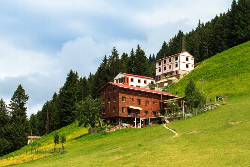 Mountain houses with beautiful sky in Ayder Plateau, Rize, Turkey.